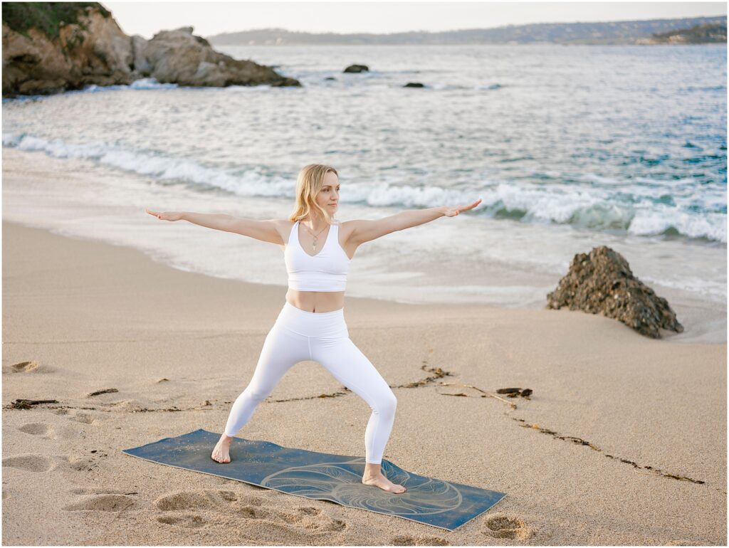 woman holding a standing yoga pose on the beach by Krista Marie Photography, a Bay Area brand photographer